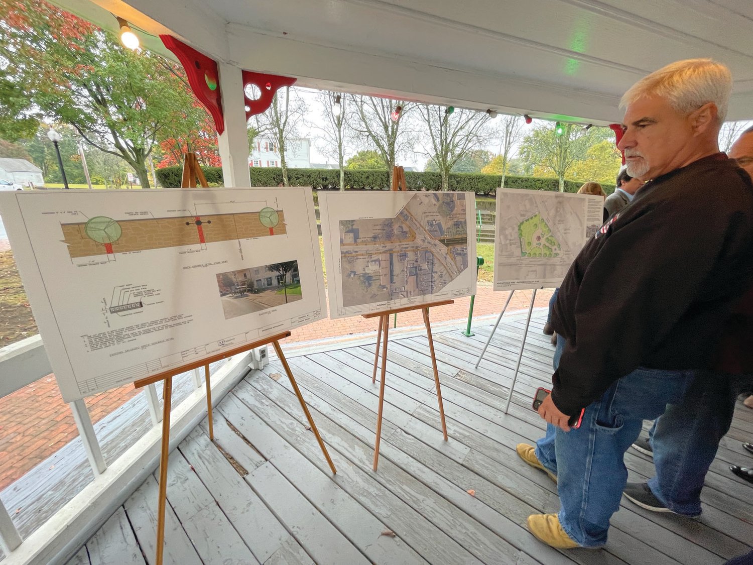 WHAT’S TO COME: During Monday’s gathering, three poster board displays were available to provide a glimpse of what’s planned as part of the Knightsville revitalization work.